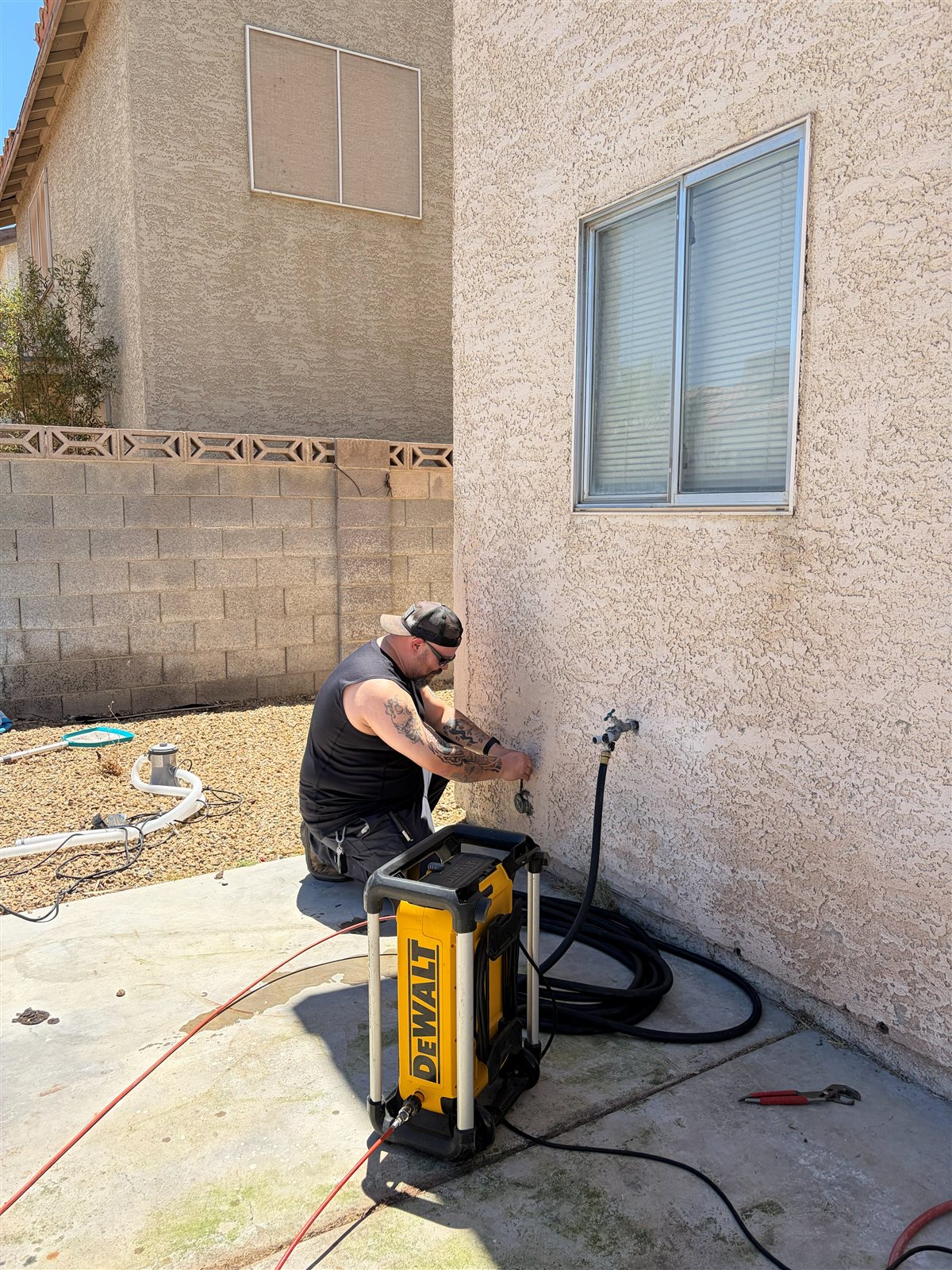 Best Solutions Hydrojetting technician setting up equipment on site